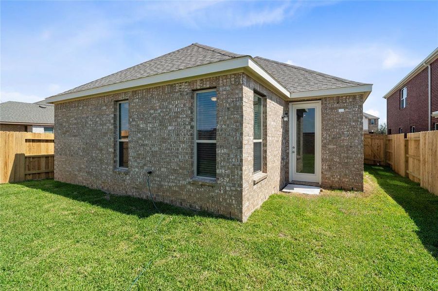 Come and see this spacious backyard with its beautiful covered patio. There is plenty of room for the kids to play and adults to relax!