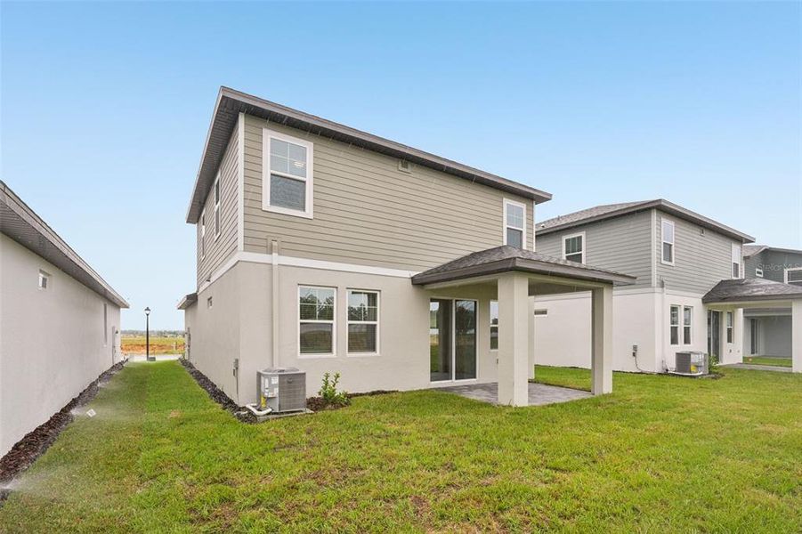 Exterior details and patio area of a home in Cyrene at Minneola, Minneola (Image 13).