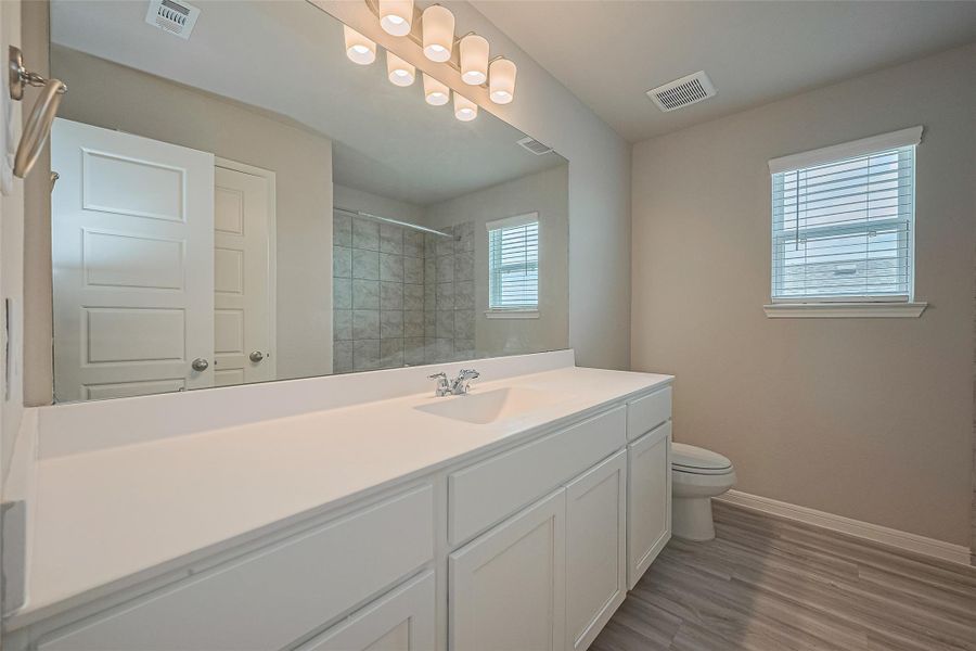 Furnished interior view inside a new home in Sunterra, Katy (Image 7).