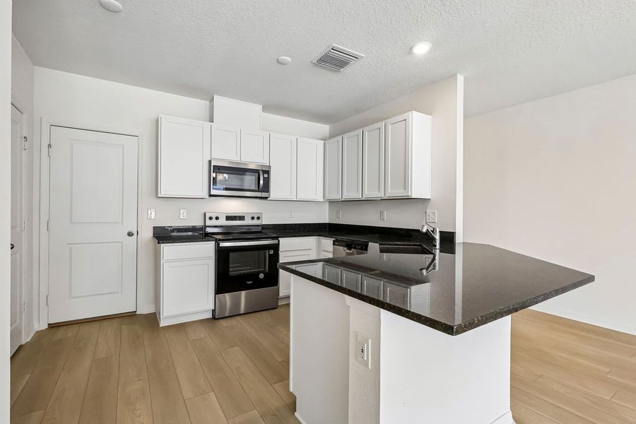 Furnished interior view inside a new home in Reserve at Forest Lake Townhomes, Lake Wales (Image 4).