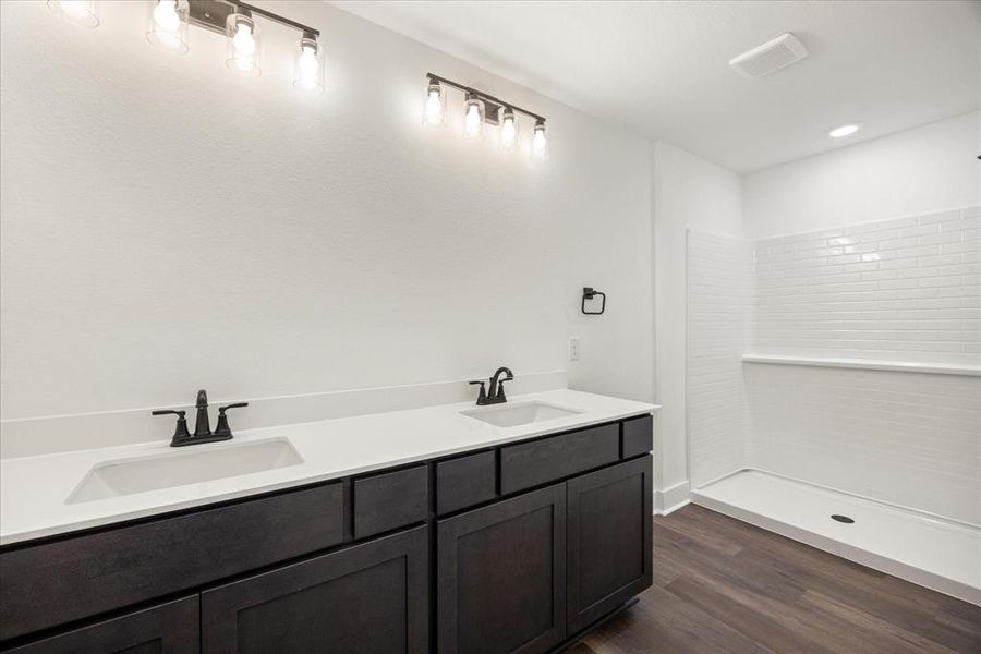 Double sinks, large shower. Double sinks, large shower.