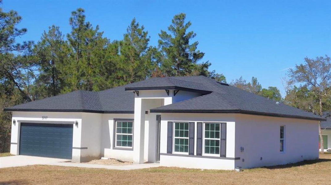 Front exterior of a new home in , Citrus Springs, FL, highlighting curb appeal (Image 2). Front exterior of a new home in , Citrus Springs, FL, highlighting curb appeal (Image 2).