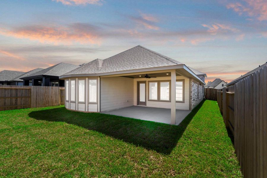 Exterior details and patio area of a home in Grand Central Park, Conroe (Image 3).