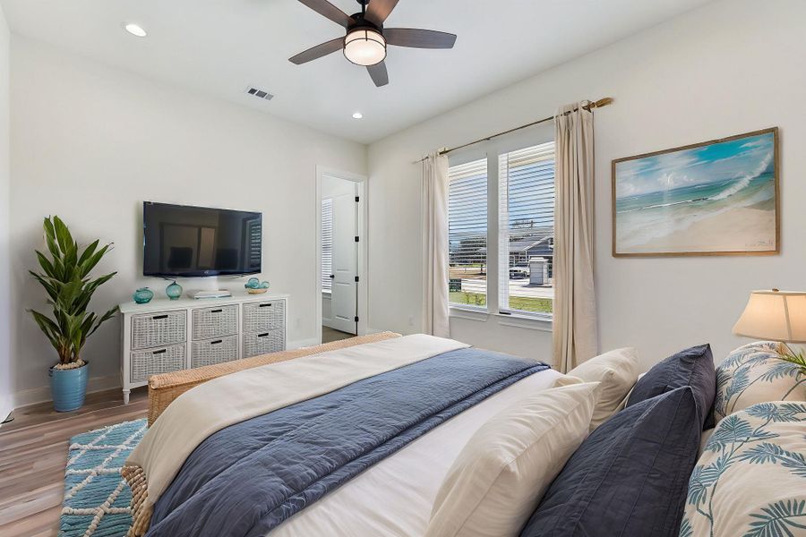Virtually Staged On-suite Bedroom featuring visible vents, a ceiling fan, recessed lighting, light wood-style floors, and baseboards Virtually Staged On-suite Bedroom featuring visible vents, a ceiling fan, recessed lighting, light wood-style floors, and baseboards