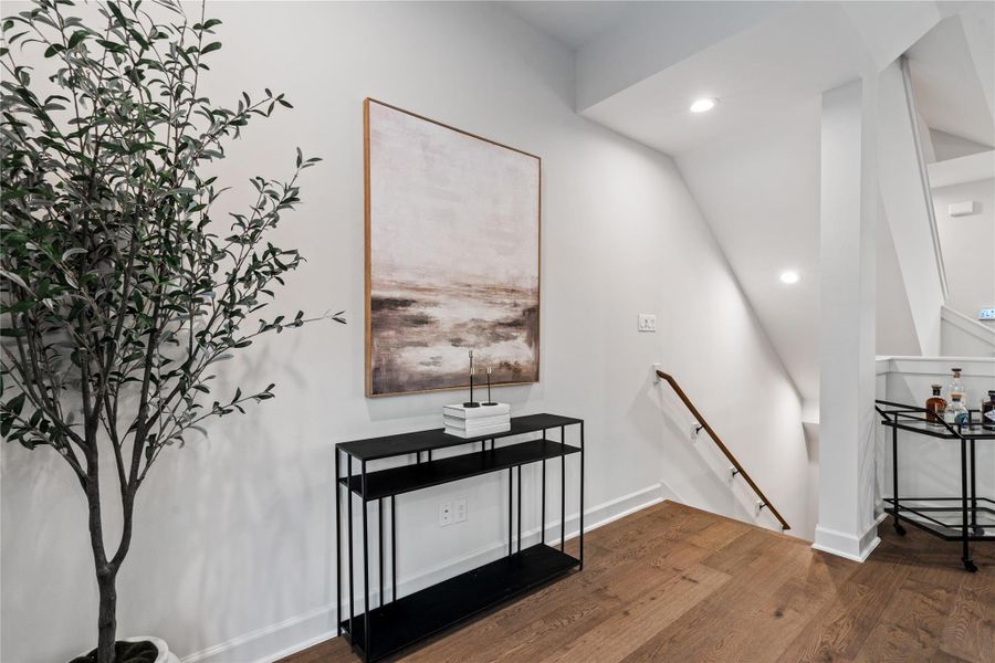 Thoughtful small details are provided as you enter the second floor living area with space to create your own whether it's a credenza or small bar area that gives each homeowner the ability to create their own personal touch.