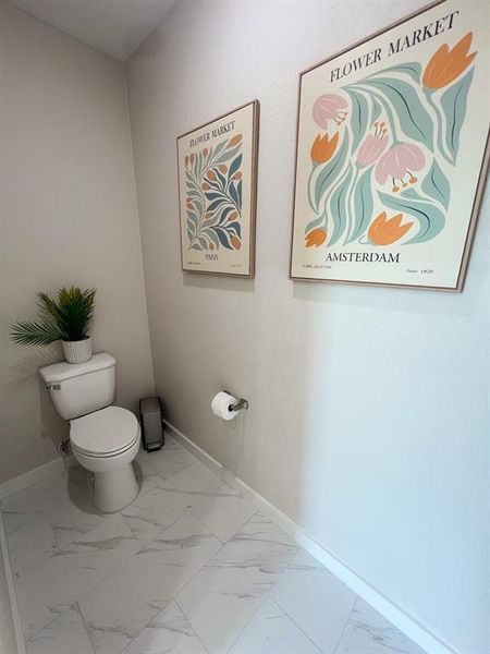 Bathroom with light marble finish floors