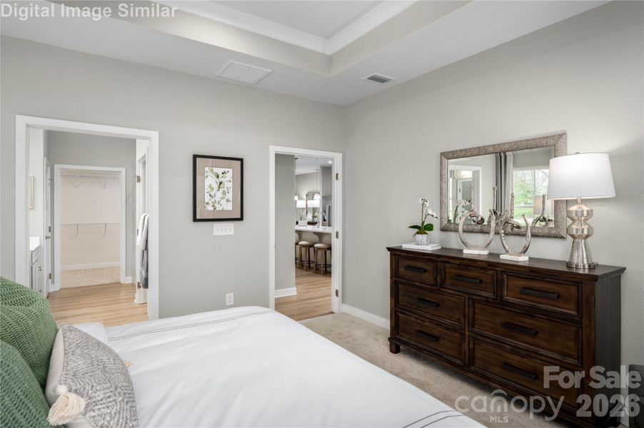 Wake up and step into luxury—your main-level primary bedroom offers direct access to a spa-inspired bath and the open-concept living space beyond. No stairs, no barriers—just seamless flow, effortless comfort, and everyday elegance. It’s the kind of layout that turns routines into rituals.