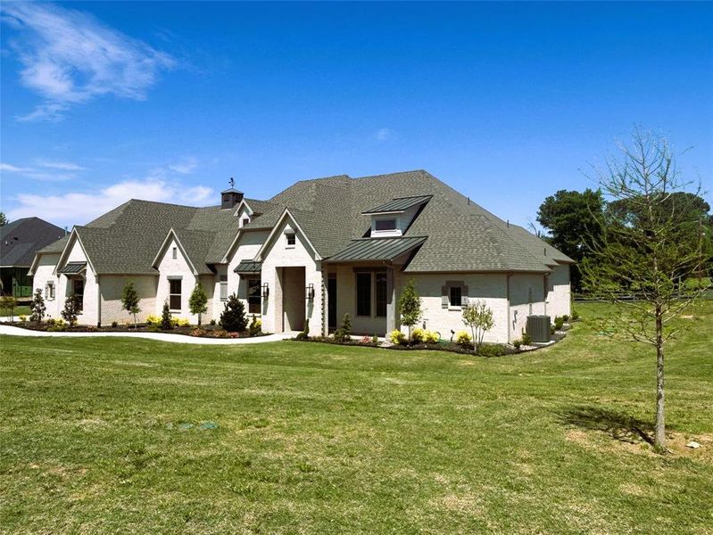 Front exterior of a new home in , Argyle, TX, highlighting curb appeal (Image 22).