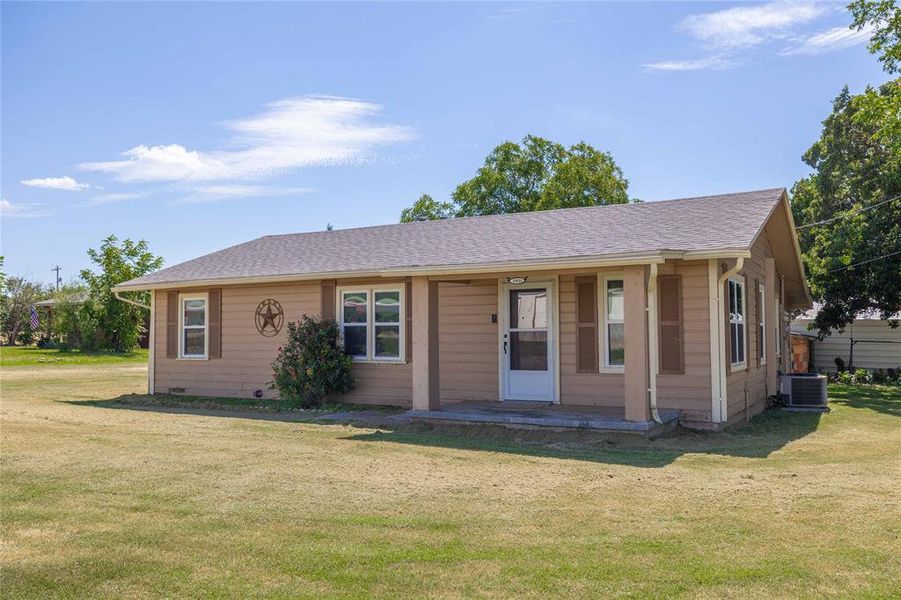 View of front of home with covered porch, a front lawn, and roof with shingles View of front of home with covered porch, a front lawn, and roof with shingles