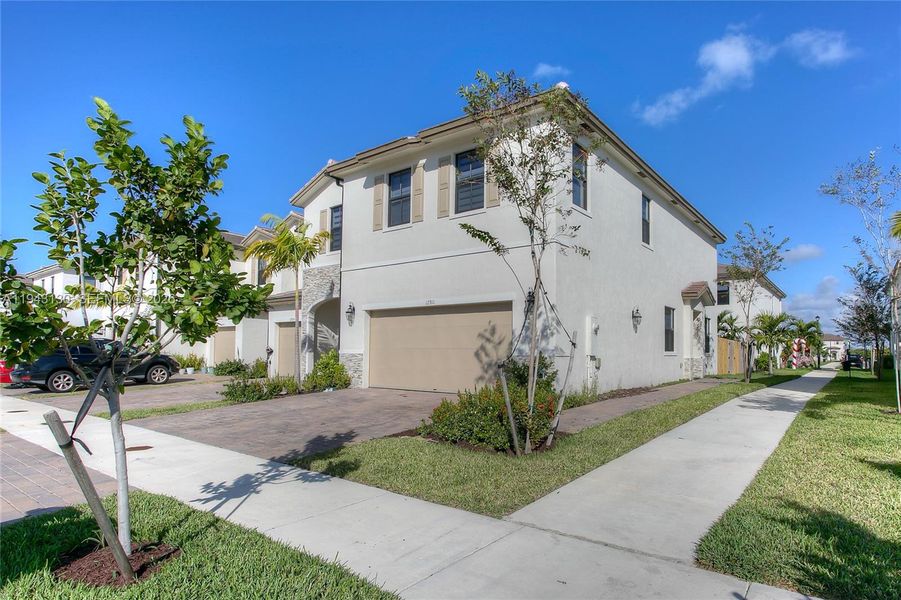 Front exterior of a new home in , Miami, FL, highlighting curb appeal (Image 1). Front exterior of a new home in , Miami, FL, highlighting curb appeal (Image 1).