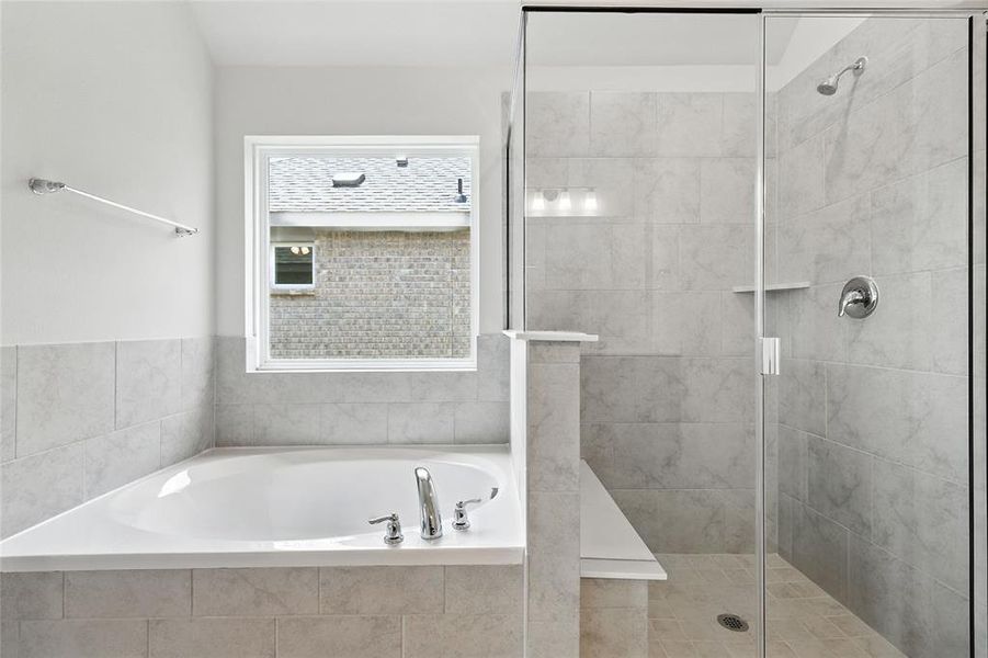 Full bath with a shower stall and a garden tub