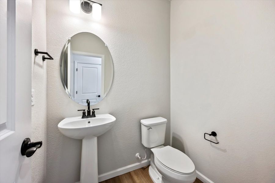 A bathroom with a sink and toilet. A bathroom with a sink and toilet.