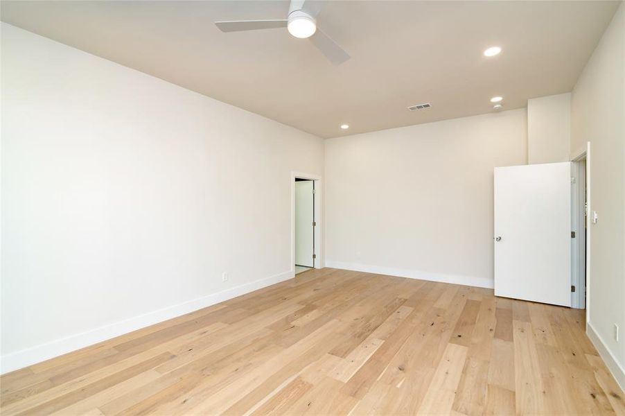 Spare room featuring light hardwood / wood-style floors and ceiling fan