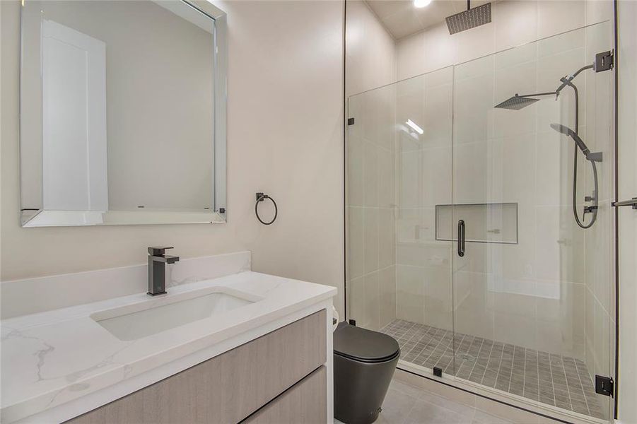Full bath with a stall shower and vanity Full bath with a stall shower and vanity