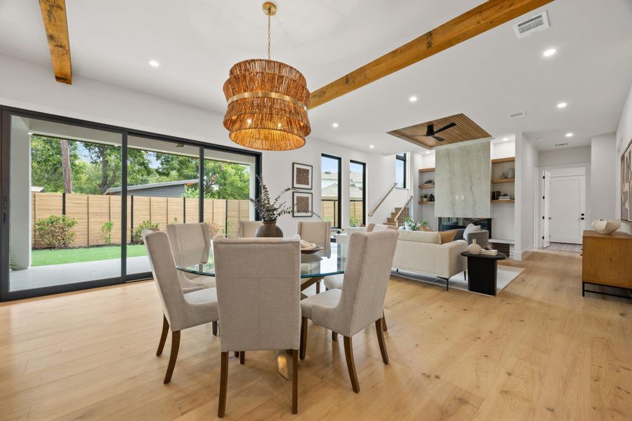 Gleaming hardwood floors and massive sliding glass doors define this open-concept architectural space.