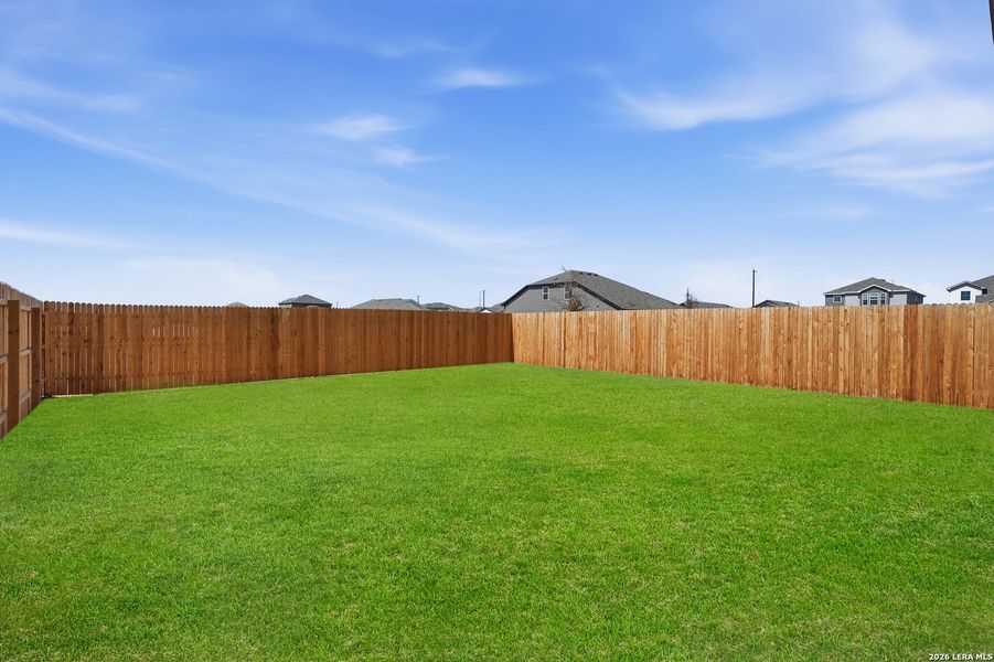 Exterior details and patio area of a home in Vista Real, Converse (Image 25).