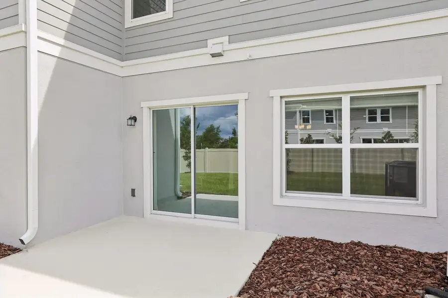 Exterior details and patio area of a home in Reserve at Forest Lake Townhomes, Lake Wales (Image 3). Exterior details and patio area of a home in Reserve at Forest Lake Townhomes, Lake Wales (Image 3).