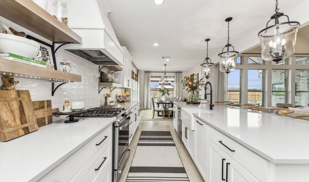 Kitchen with floating shelves and pendant lights