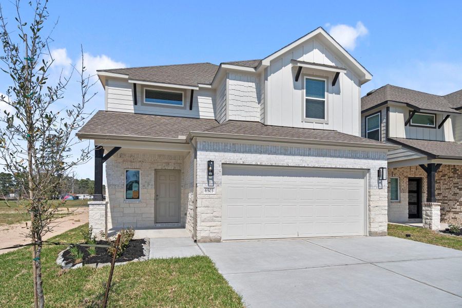 Front exterior of a new home in Cypresswood Landing, Humble, TX, highlighting curb appeal (Image 18).