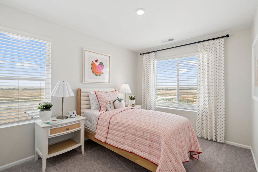 Representative furnished interior of a home built from the 2003 by Risewell Homes in Harvest Crossing, Aurora (Image 15).