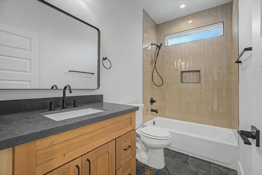 Secondary bathroom featuring a bathtub and shower combination.