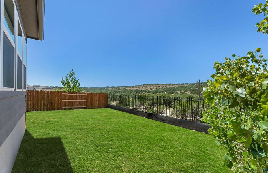 Exterior details and patio area of a home in West Cypress Hills, Spicewood (Image 18).