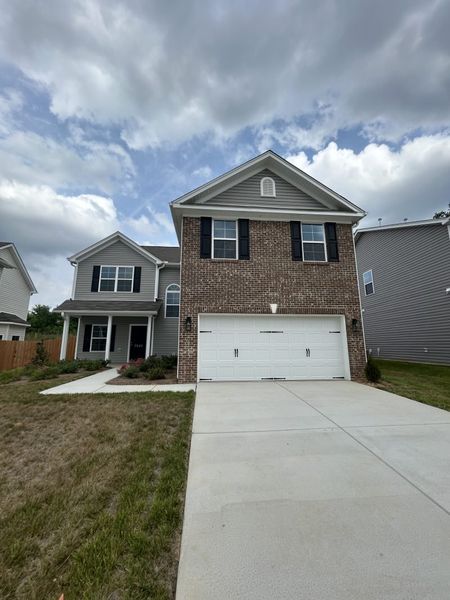 Front exterior of a new home in The Wilcox, Greensboro, NC, highlighting curb appeal (Image 26). Front exterior of a new home in The Wilcox, Greensboro, NC, highlighting curb appeal (Image 26).