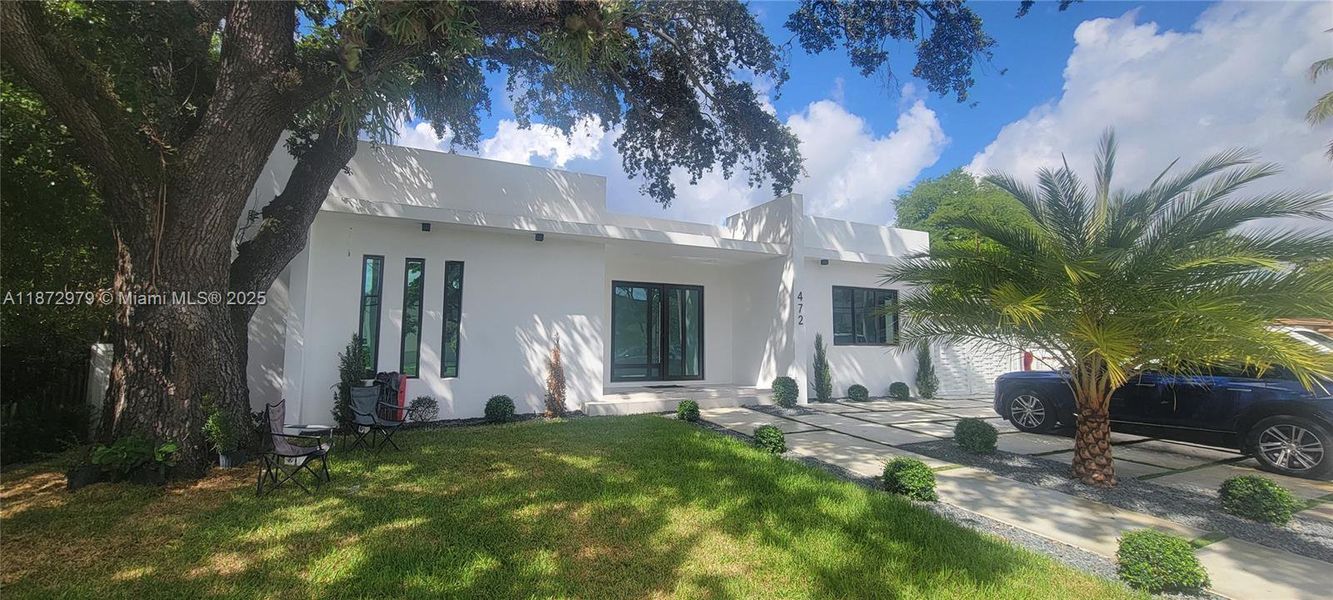 Front exterior of a new home in , Miami Springs, FL, highlighting curb appeal (Image 1).