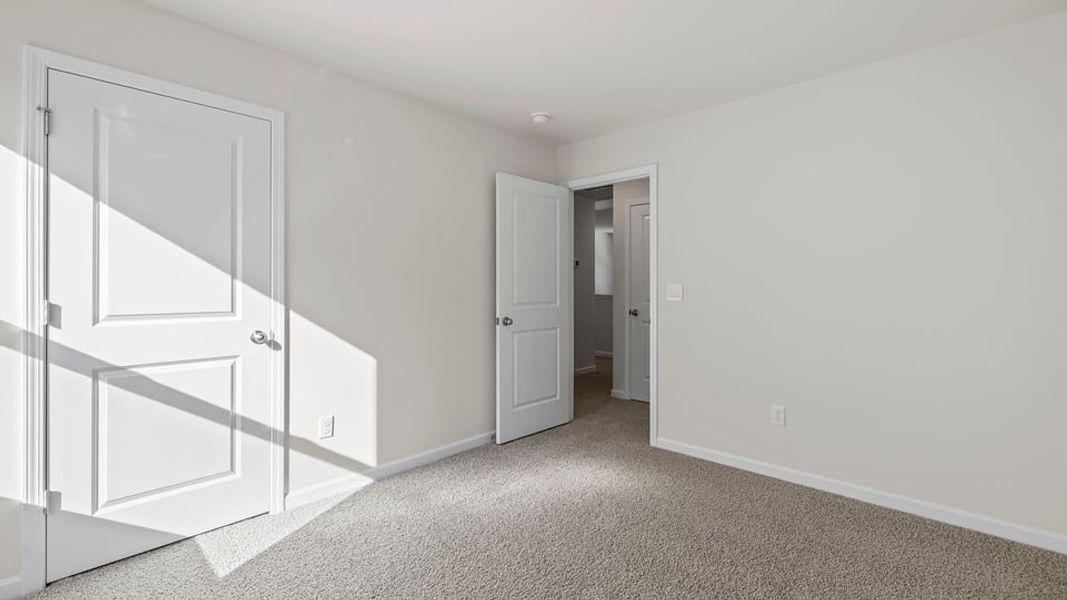 Spacious, unfurnished interior of a new home in Bentley Park, Greenwood (Image 28).