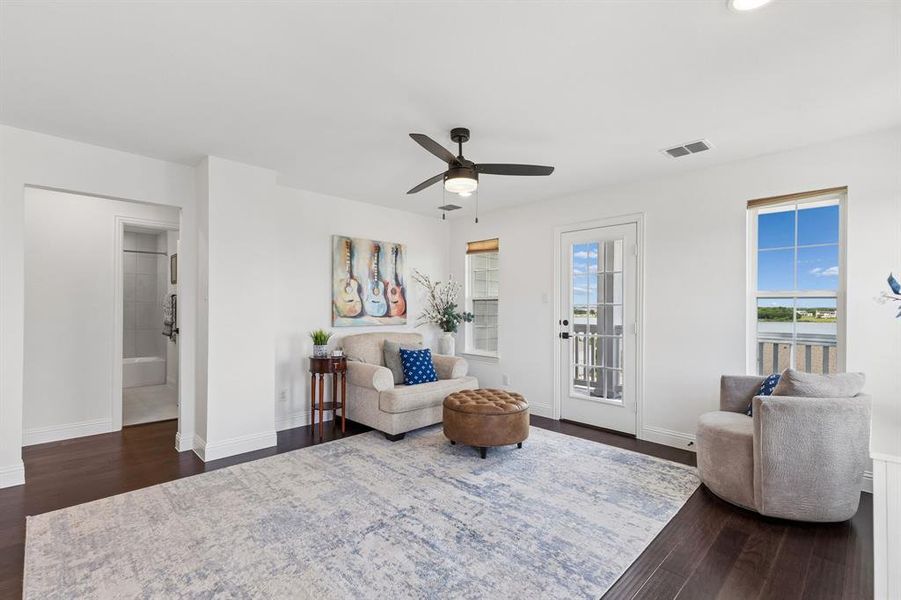 The upstairs gameroom offers a flexible gathering space with lake views, balcony access, and plenty of room for movie nights, games, or casual entertaining.