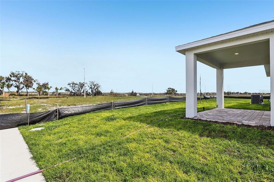 Exterior details and patio area of a home in Willowbrook North, Winter Haven (Image 19).