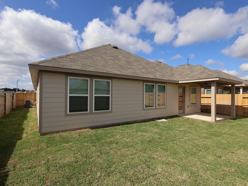 Exterior details and patio area of a home in Pinewood at Grand Texas, New Caney (Image 1).