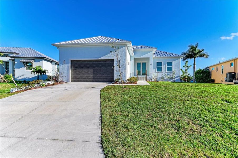 Front exterior of a new home in , Punta Gorda, FL, highlighting curb appeal (Image 31).