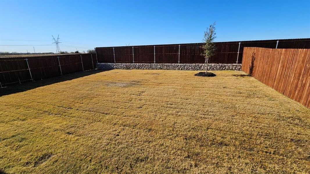 Exterior details and patio area of a home in Monarch at the Meadows, Denton (Image 3). Exterior details and patio area of a home in Monarch at the Meadows, Denton (Image 3).