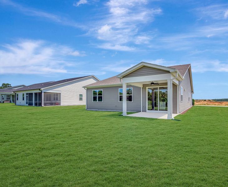 Exterior details and patio area of a home in Providence Creek, Fuquay Varina (Image 2).