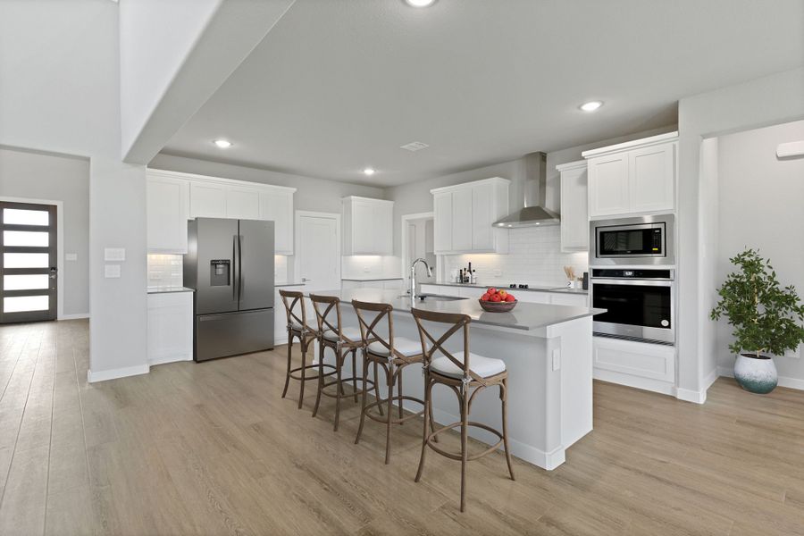 Kitchen in the Henley home plan by Trophy Signature Homes – REPRESENTATIVE PHOTO Kitchen in the Henley home plan by Trophy Signature Homes – REPRESENTATIVE PHOTO