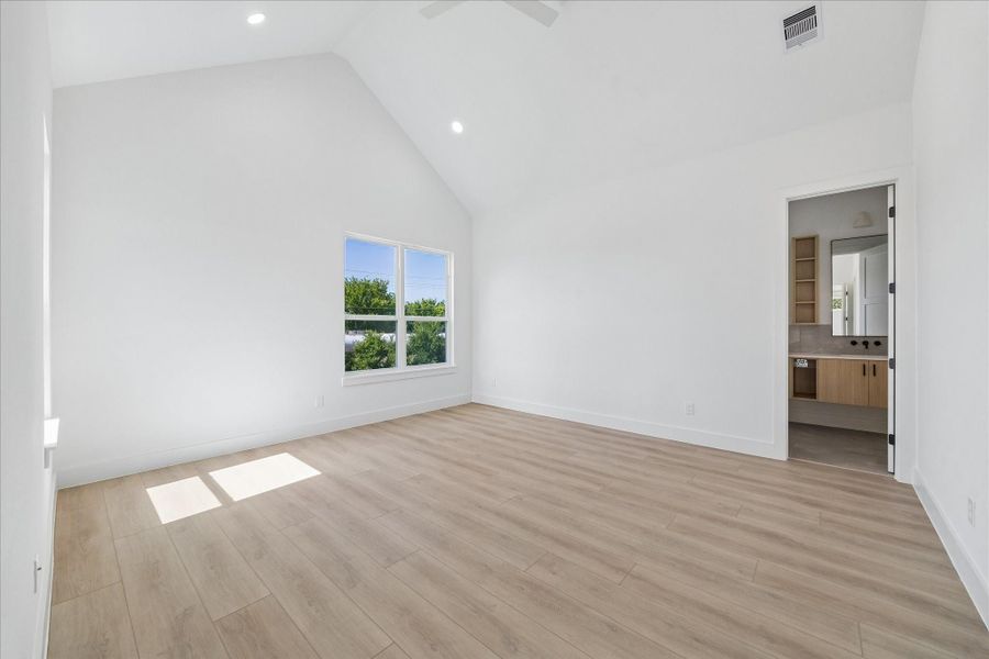 Vaulted ceilings, oversized windows, and warm natural finishes create a peaceful retreat filled with light.
