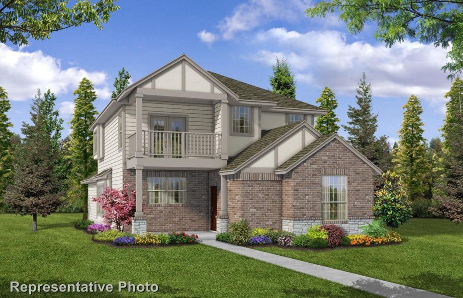 View of front of house with a front lawn and a balcony