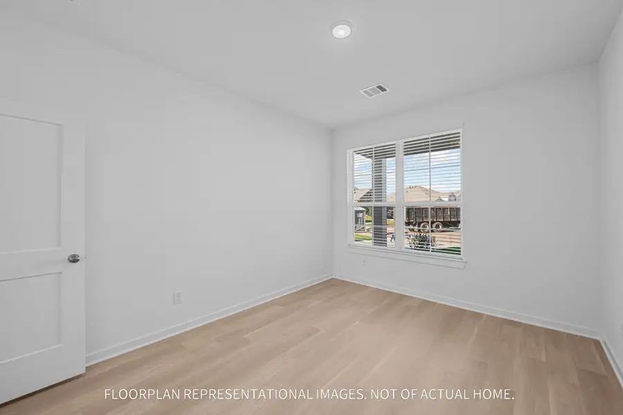 Spacious, unfurnished interior of a new home in The Oaks on 6th Street, Magnolia (Image 10).