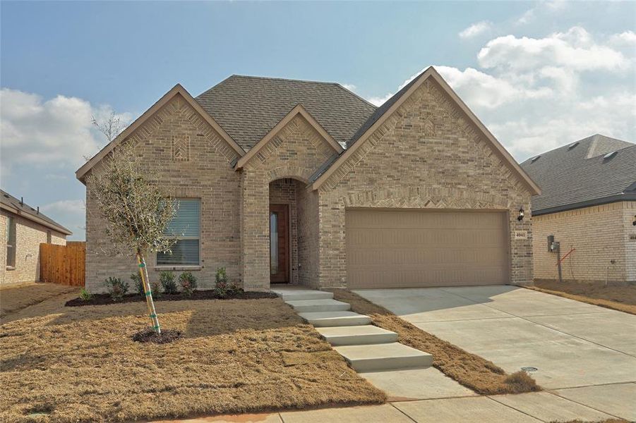 View of front of home featuring a garage