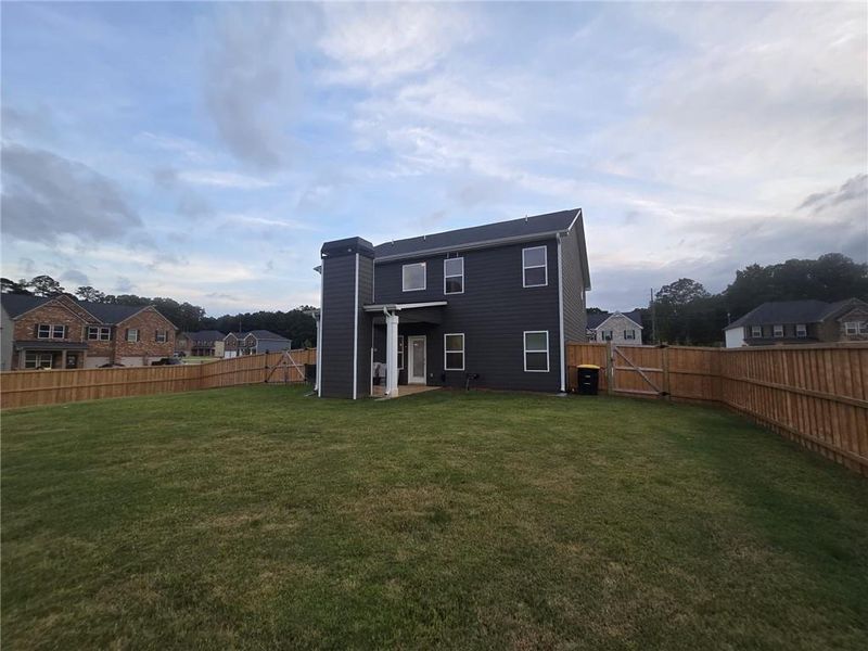 Exterior details and patio area of a home in Fern Dale, Fairburn (Image 44).