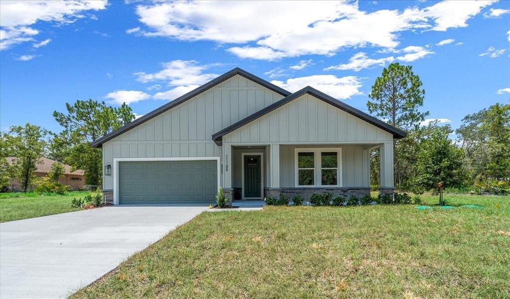 Front exterior of a new home in , Weeki Wachee, FL, highlighting curb appeal (Image 36). Front exterior of a new home in , Weeki Wachee, FL, highlighting curb appeal (Image 36).