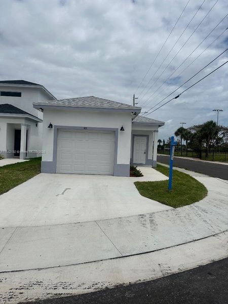 Front exterior of a new home in , Boynton Beach, FL, highlighting curb appeal (Image 23).