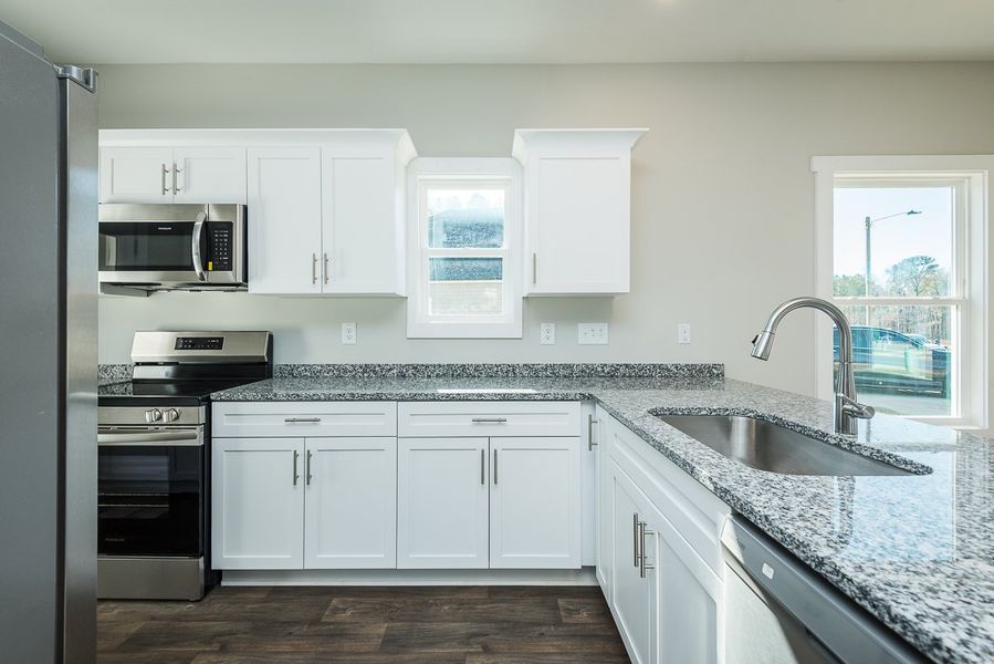 Representative furnished interior of a home built from the Thomas by Foundation Home Builders LLC in Pinnix Loop, Burlington (Image 6).
