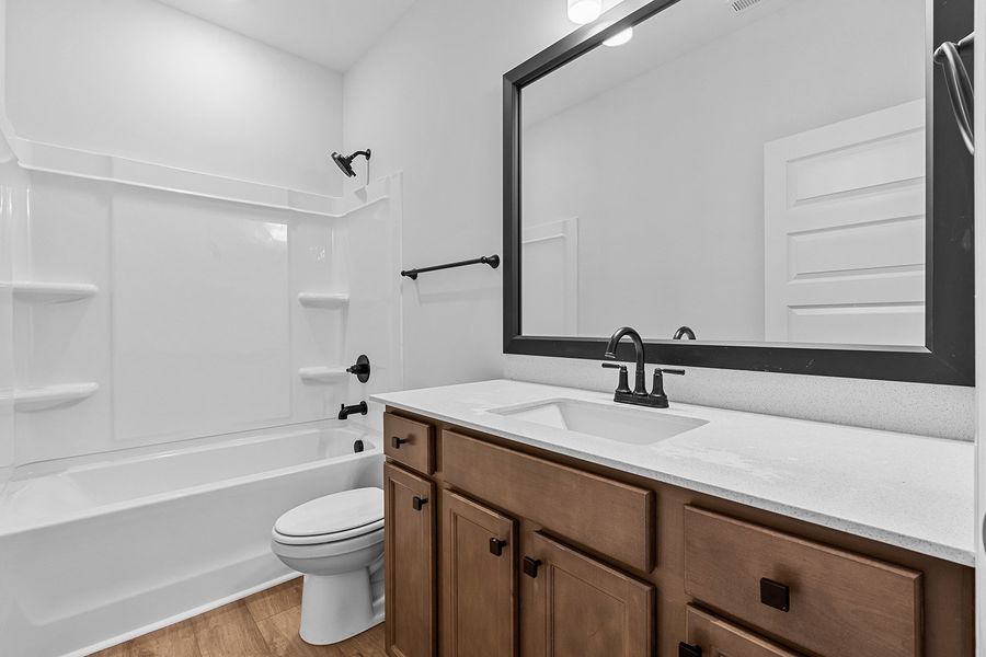 Furnished interior view inside a new home in Brayden, Advance (Image 11).