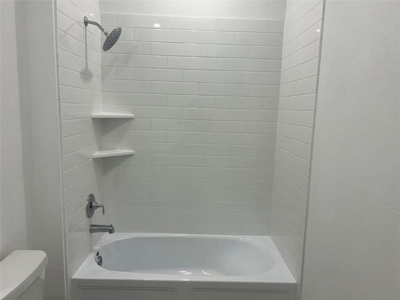 The Tub shower with shelves in the Hall Bathroom. The Tub shower with shelves in the Hall Bathroom.