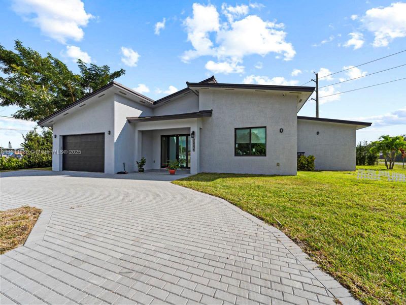Front exterior of a new home in , Goulds, FL, highlighting curb appeal (Image 20). Front exterior of a new home in , Goulds, FL, highlighting curb appeal (Image 20).