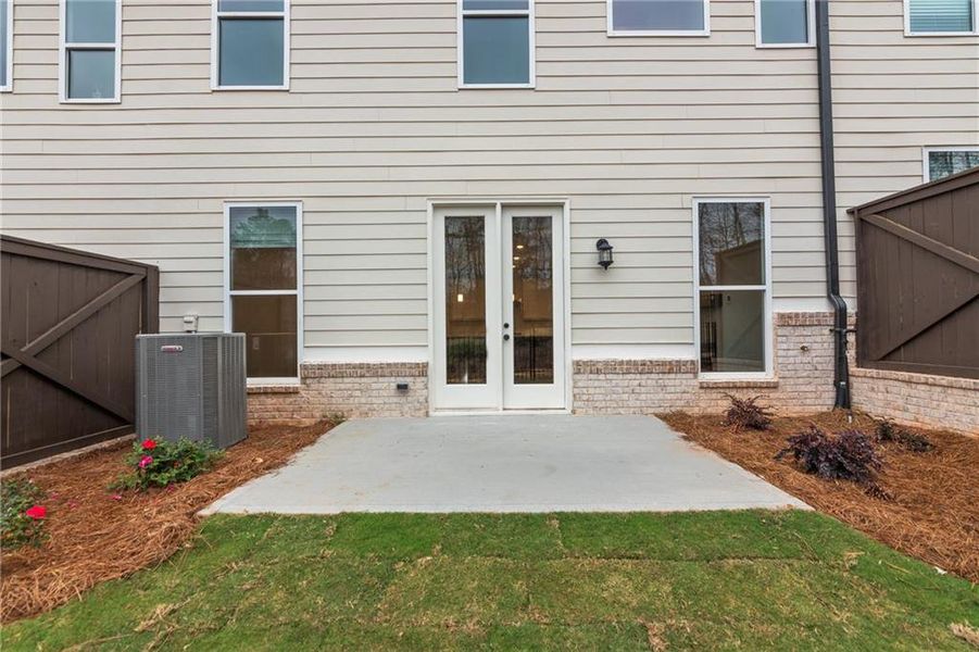 Exterior details and patio area of a home in Waterside Townhomes, Peachtree Corners (Image 3).