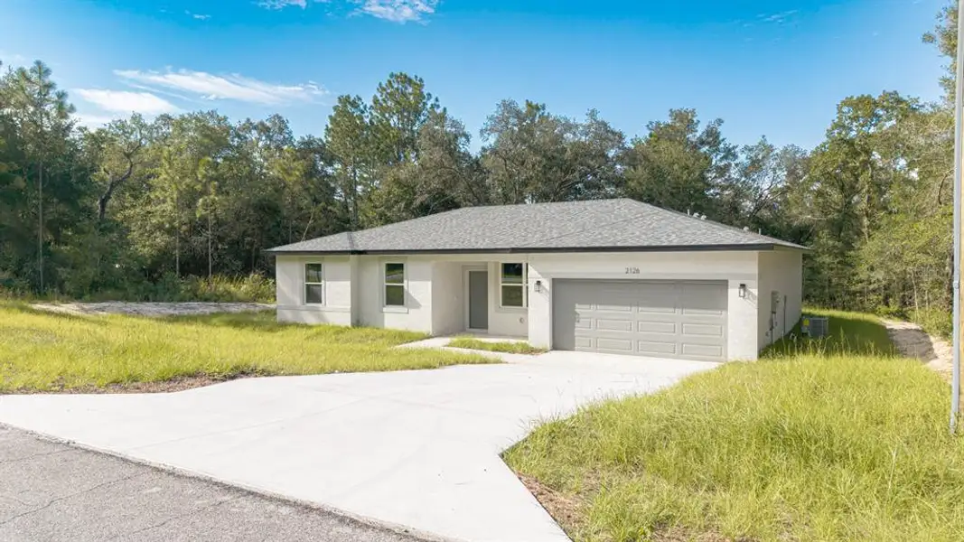 Front exterior of a new home in , Dunnellon, FL, highlighting curb appeal (Image 1). Front exterior of a new home in , Dunnellon, FL, highlighting curb appeal (Image 1).