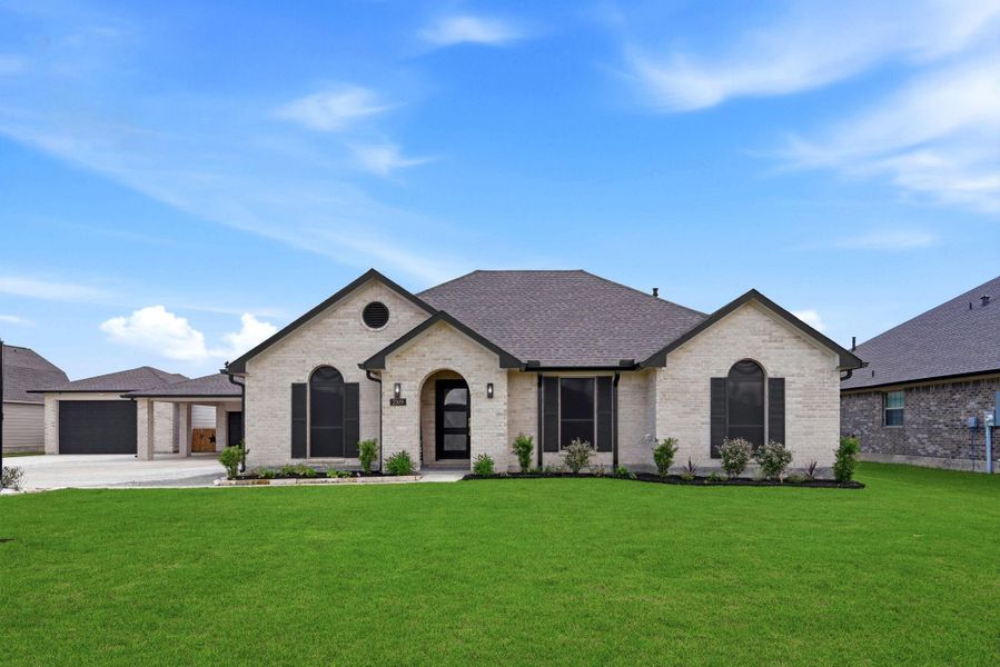 Front exterior of a new home in Pedregal, Dickinson, TX, highlighting curb appeal (Image 25).